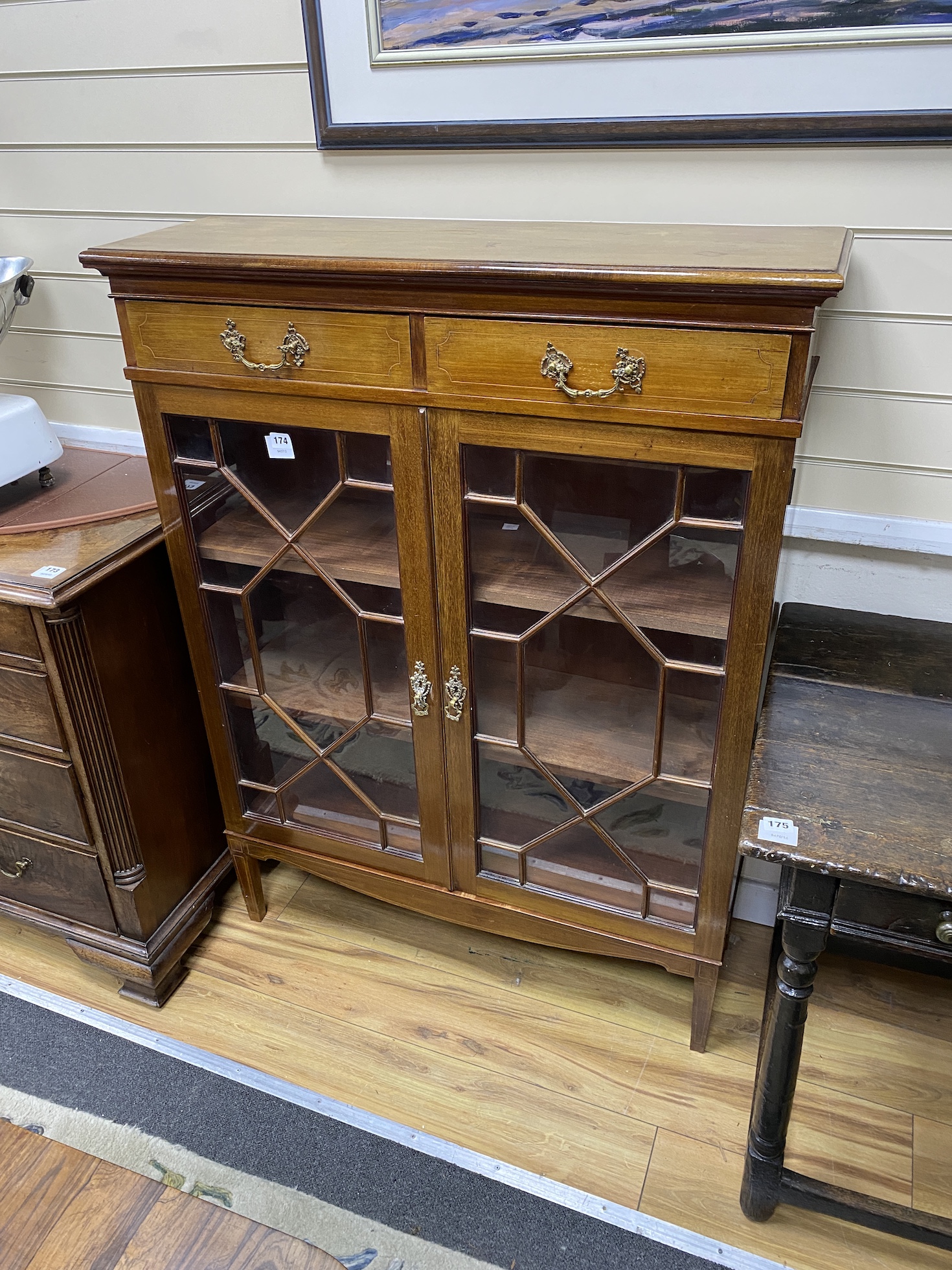 An Edwardian mahogany bookcase, glazed doors, width 95cm, depth 30cm, height 126cm